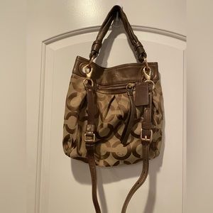 Brown coach purse. Lavender interior